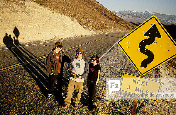 Portrait of three pro-snowboarders near Death Valley  California.