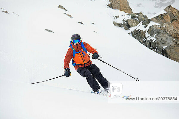 Backcountry skier carves an edge along the Spearhead Traverse