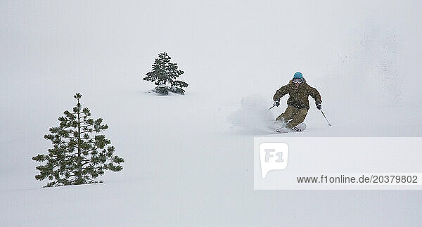 Female skier enjoying the fresh powder snow.