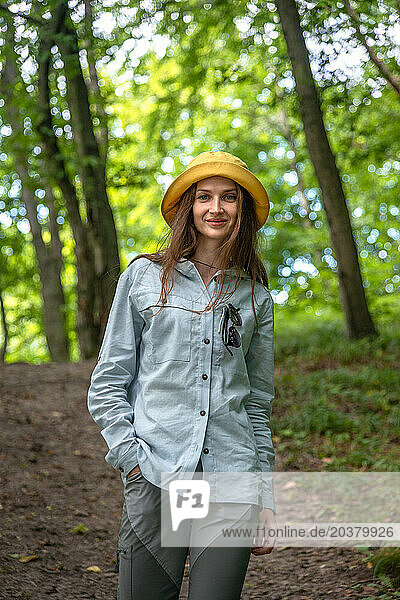 Portrait Young Woman Walking in the Deep Green Forest.
