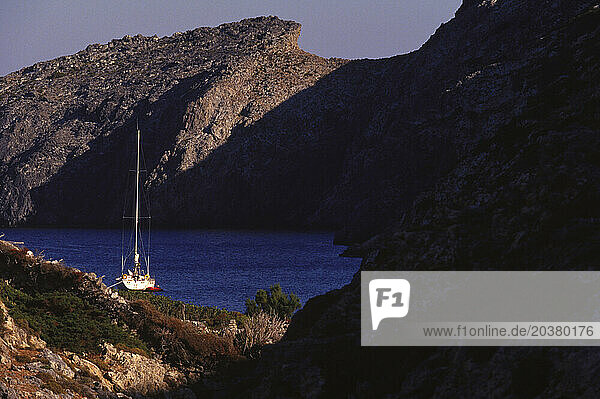 Sailboats between rocks in Kineros  Greece.