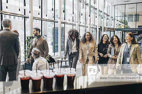 Group of male and female business professionals during networking event at convention center