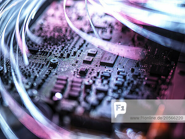 Illuminated fiber optics on mother board of laptop computer