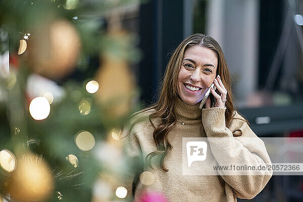 Smiling businesswoman talking on smart phone