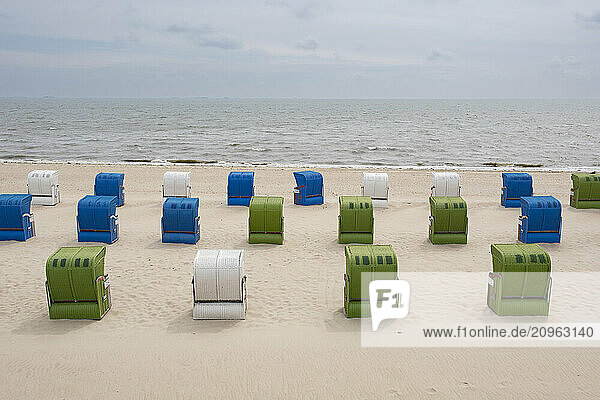 Germany  Schleswig-Holstein  Wyk  Hooded beach chairs on sandy beach