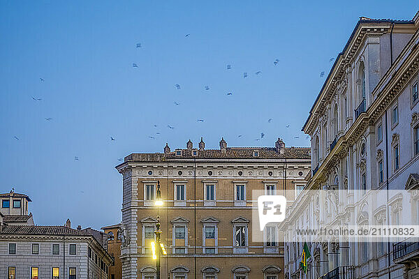 View of architectural buildings in Piazza Navona at dusk in Rome  Italy