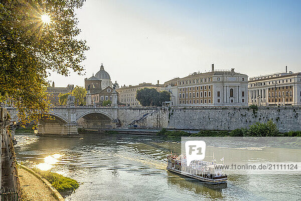 Ferry sailing through River Tiber at sunny day in Lazio  Rome  Italy
