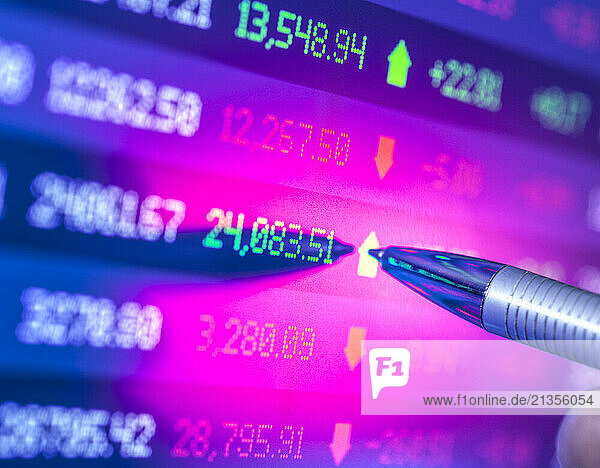 City analyst viewing financial market data on touch screen