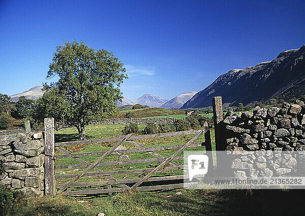United Kingdom. England. Cumbria. Wasdale. Gate in dry stone wall.
