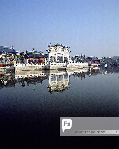 China. Jiangsu. Lake side. Traditional Chinese gate & ancient buildings.