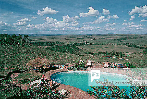 Kenya. Maasai Mara. High viewpoint with hotel pool at Mara Serena Safari Lodge.