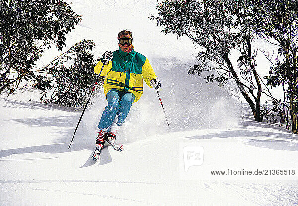 Australia. Thredbo. Snow skiing. Young man downhill skiing.