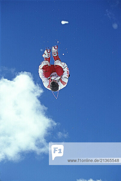 Australia. Victoria. Mount Buller. Young man snow skiing somersault.