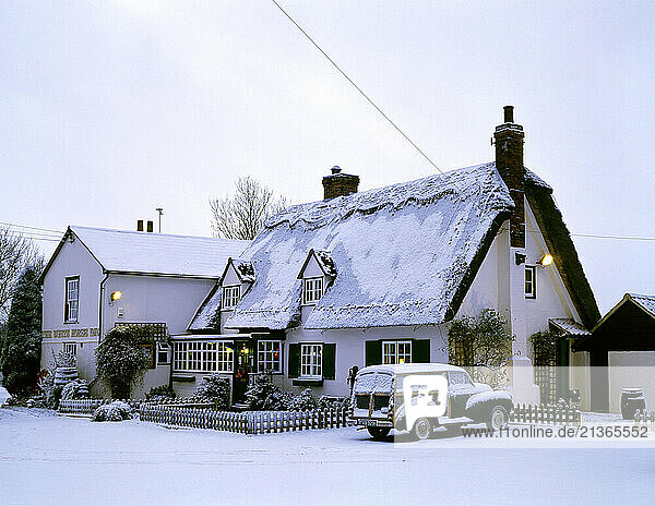 United Kingdom. England. West Suffolk. Withersfield. White Horse Inn in winter snow.