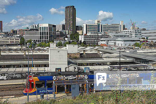 Sheffield Railway station seen from the east with Supertram stop in foreground and city centre behind  Granville Street  Sheffield  Yorkshire  England
