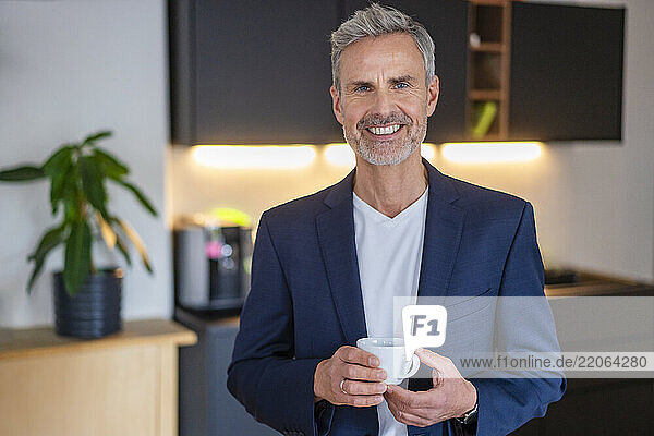 Businessman enjoying coffee break at office