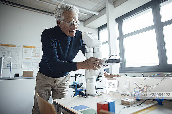 Engineer working with robotics in a laboratory office