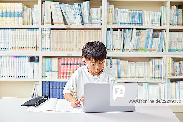 Japanese Kid In School Library