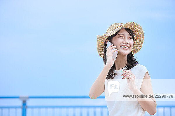Japanese Woman In At Talking On Cell Phone