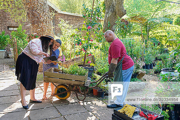 Disabled man and women working in plant nursery