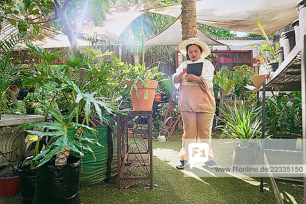 Disabled woman working at plant nursery
