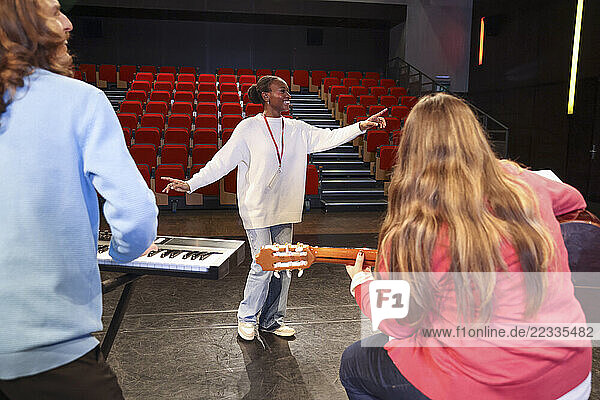 Friends playing and singing during rehearsal