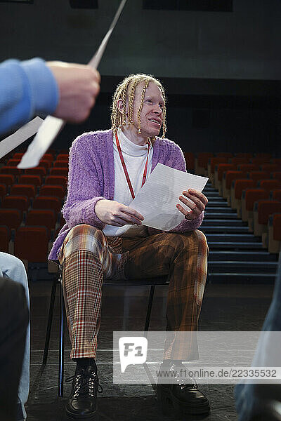 Man reading text during rehearsal