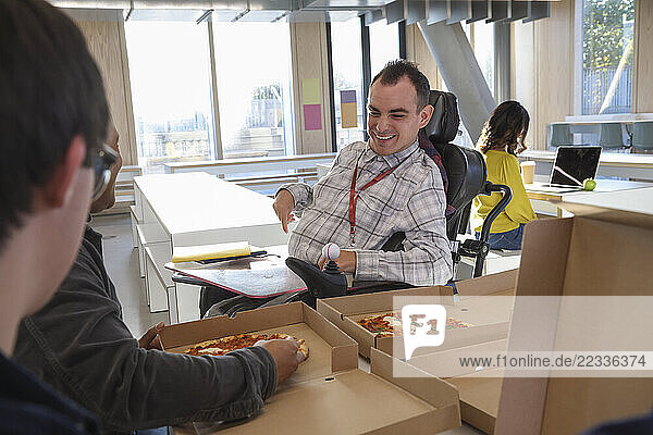 Disabled people enjoying pizza