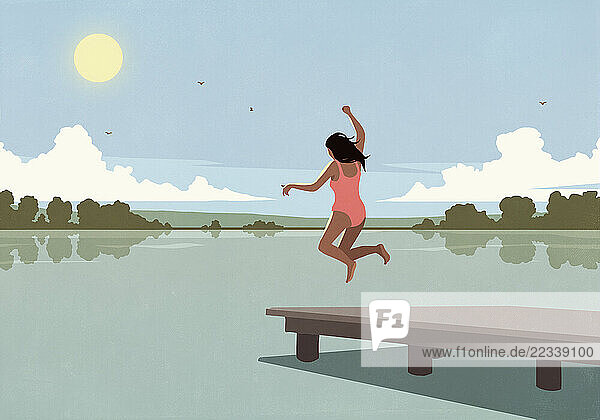 Carefree woman jumping from dock into sunny summer lake