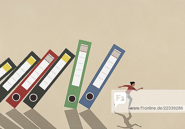 Businesswoman running from falling binders