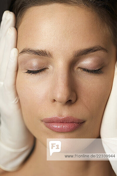 Close up of a woman s face during a cosmetic examination