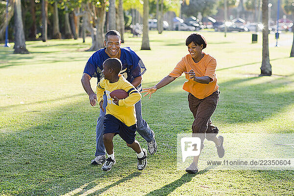 Family Playing Football