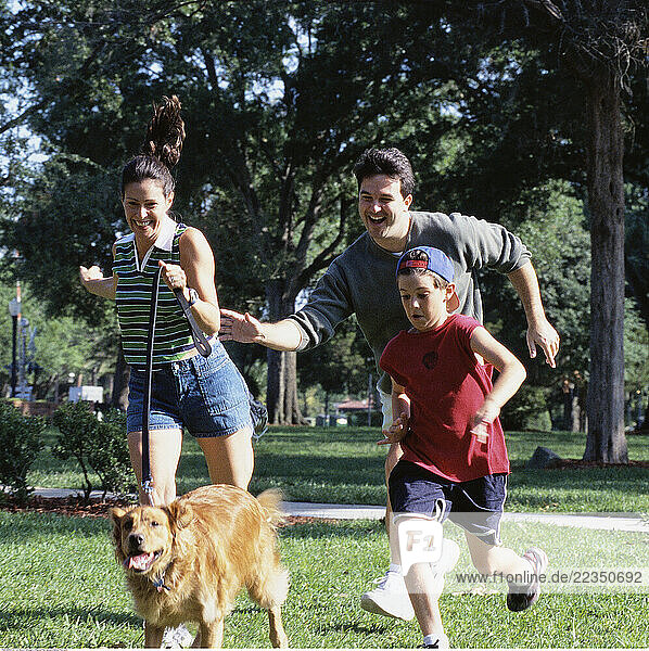 Family Running With Dog
