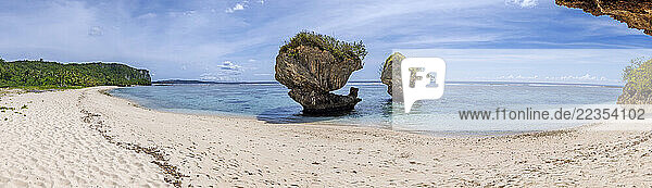 Panorama of the clear warm waters and mushroom rocks at Hilaan Beach  Guam  Micronesia in the Mariana Islands of the Pacific Ocean. Eight images were combined for this high resolution file; Guam  Micronesia