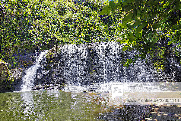 Landscape of Talofofo Falls  a waterfall with jungle and blue sky in the background  Inarajan  Guam  Micronesia  US Territory  Central Pacific Ocean; Inarajan  Guam  Mariana Islands  Micronesia