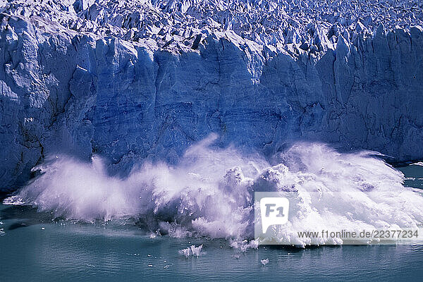 Parque Nacional de Los Glaciares  PATAGONIA  AR - February 2005: A massive serac breaks off into Lago Argentino from the Perito Moreno Glacier found in Parque Nacional de Los Glaciares in the Santa Cruz province of Argentina which is part of Patagonia in February of 2005. The Moreno glacier is a major tourist attraction  as people the world over come to witness the 200 foot seracs crashing into the water. This glacier is one of the few in the world that is not in rapid recession. (Photo By Dan Rafla/Aurora)