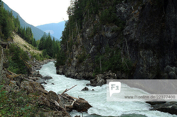 Incomappleau (Fish) River is the scene where coldwater rescue teams involving raft  kayak and helicopter crews scour upper reaches of the Incomappleau (Fish) River for signs of a mountaineer/kayak team missing in Beaton  British Columbia. Missing are: Yves Laforest (first of Quebec to climb Everest)  Michel Bastien  and a third unidentified woman. The three went missing after their kayaks overturned. A fourth man  Martin Champagneur  has been rescued.