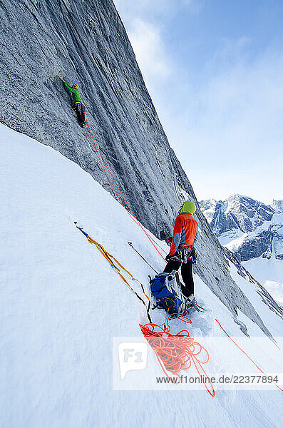 Hayden Kennedy belays Tommy Caldwell on the first pitch of rock during their first ascent in the Arrigetch Peaks  Brooks Range  Alaska.
