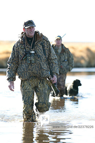 Brad Jackson and Corey Funk hunt ducks with their dog Grizzly in Carson City  NV.