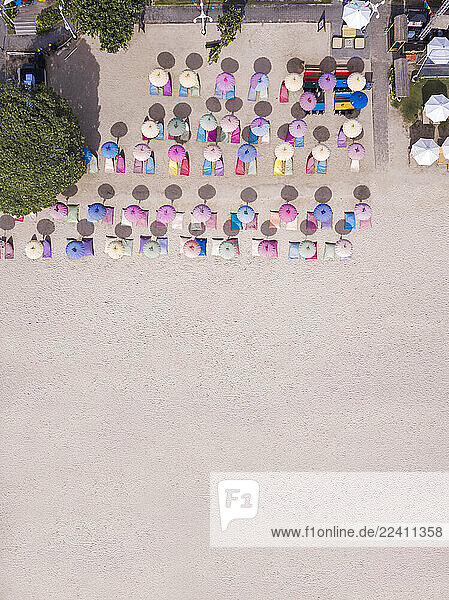 Indonesia  Bali  Nusa Dua  Aerial view of colorful umbrellas on resort beach