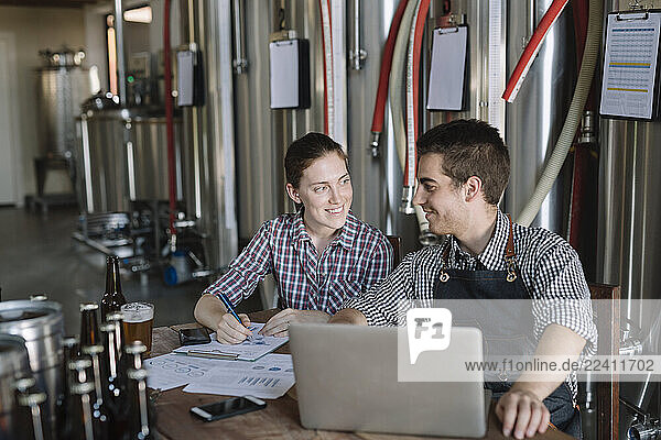Young entrepreneurs working at a brewery