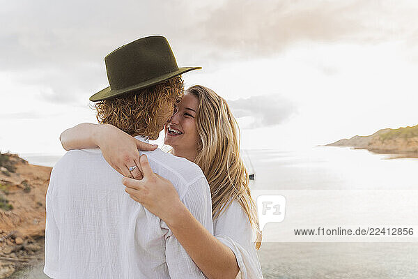 Young couple in love in front of the sea  Ibiza  Balearic Islands  Spain