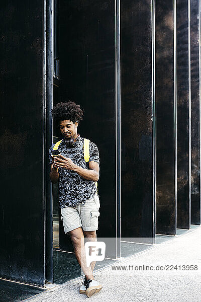 Man using smartphone outdoors  Barcelona  Spain
