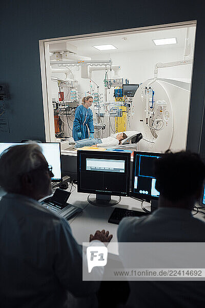Medical staff conducting an MRI scan in a clinical setting