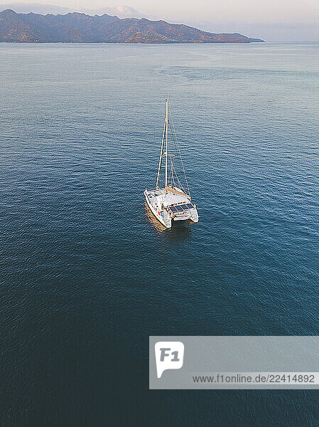 Drone shot of catamaran on sea at Gili-Air Island during sunset  Bali  Indonesia