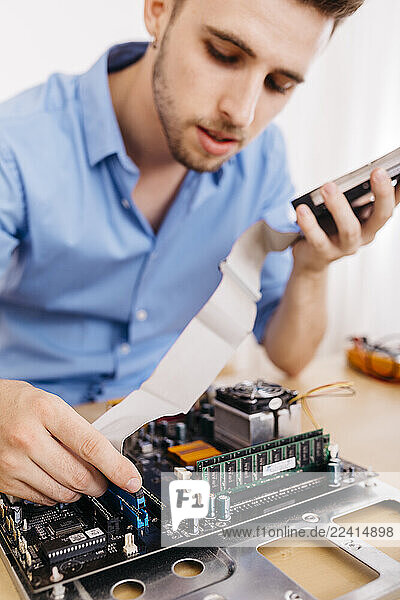 Technician repairing a desktop computer