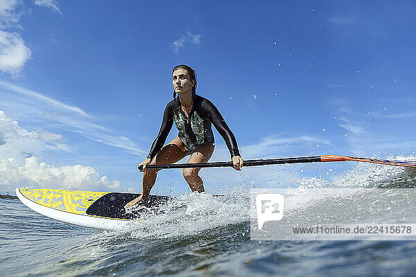 Female SUP surfer  Bali  Indonesia