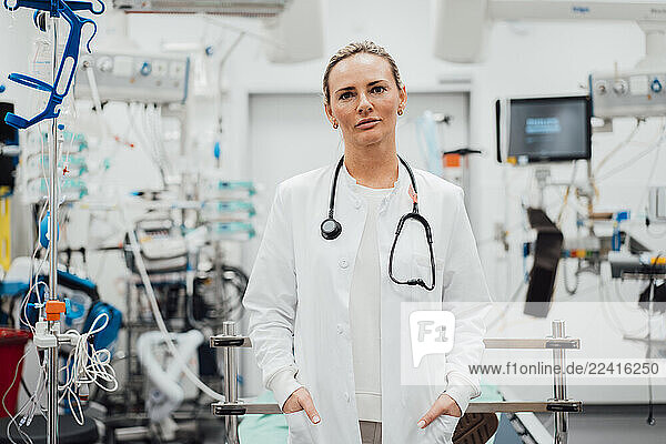 Doctor in an emergency room with medical equipment in the background
