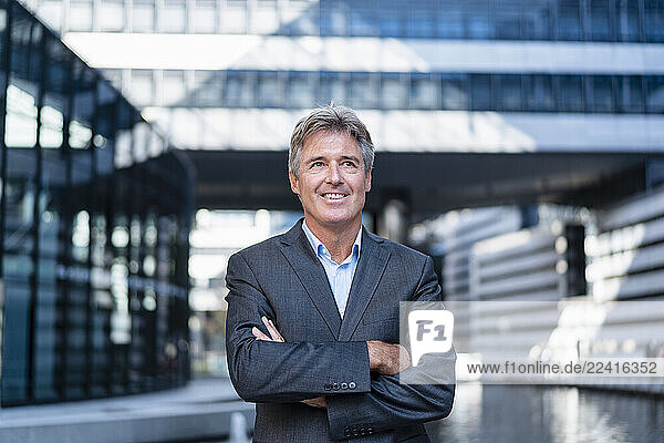 Portrait of smiling mature businessman in the city