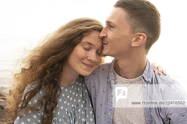 Portrait of young couple at the beach